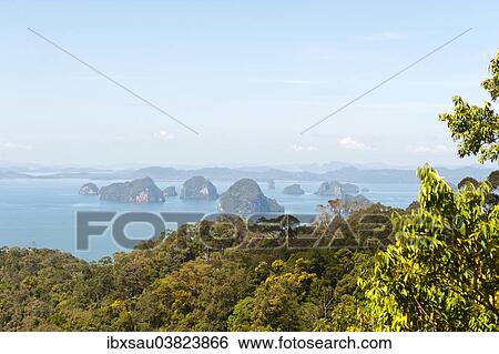 "Forested Karst islands rising from the sea, view of Phang Nga Bay from Snakehead mountain, Andaman Sea, Ao Nang, Krabi Province, Southern Thailand, Thailand, Asia" View Large Photo Image Stock Photograph - "Forested Karst islands rising from the sea, view of Phang Nga Bay from Snakehead mountain, Andaman Sea, Ao Nang, Krabi Province, Southern Thailand, Thailand, Asia". Fotosearch