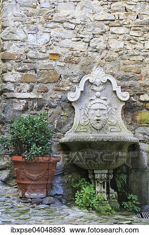 "Fountain and a terracotta flower pot, medieval village of Dolceaqua, Province of Imperia, Liguria, Italian Riviera, Italy, Europe" View Large Photo Image Stock Image - "Fountain and a terracotta flower pot, medieval village of Dolceaqua, Province of Imperia, Liguria, Italian Riviera, Italy, Europe". Fotosearch