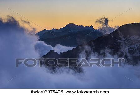 "Four climbers on the mountain edge heading to Quintino Sella Hut, with Mont Blanc at the back, Monte Rosa, Alps, Valle d'Aosta, Italy, Europe" View Large Photo Image Stock Photograph - "Four climbers on the mountain edge heading to Quintino Sella Hut, with Mont Blanc at the back, Monte Rosa, Alps, Valle d'Aosta, Italy, Europe". Fotosearch