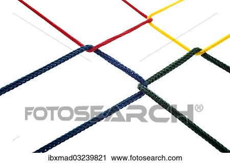 Stock Image - "Four colored cords are intertwined, networking, symbolic image". Fotosearch