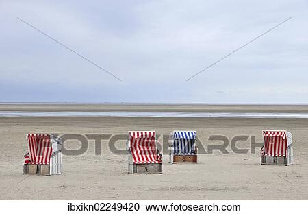 "Four roofed wicker beach chairs, beach on the North Sea, St. Peter-Ording, Schleswig-Holstein, Germany, Europe" View Large Photo Image Stock Image - "Four roofed wicker beach chairs, beach on the North Sea, St. Peter-Ording, Schleswig-Holstein, Germany, Europe". Fotosearch