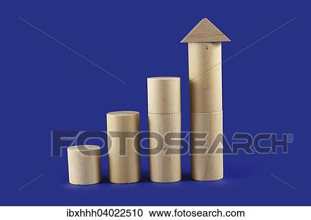 Stock Image - Four towers of round wooden building blocks. Fotosearch