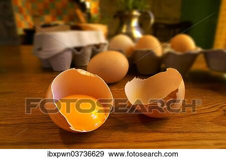 "Free-range eggs, one cracked with a yoke, in a country kitchen setting" View Large Photo Image Stock Photo - "Free-range eggs, one cracked with a yoke, in a country kitchen setting". Fotosearch