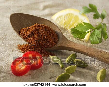 "Fresh ground chilis with cardamom seeds, lemon and coriander, Indian spices" View Large Photo Image Picture - "Fresh ground chilis with cardamom seeds, lemon and coriander, Indian spices". Fotosearch