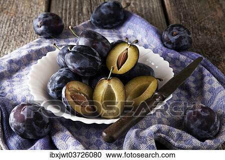 "Fresh plums (Prunus domestica) on plate, with a knife and a kitchen towel" View Large Photo Image Stock Image - "Fresh plums (Prunus domestica) on plate, with a knife and a kitchen towel". Fotosearch