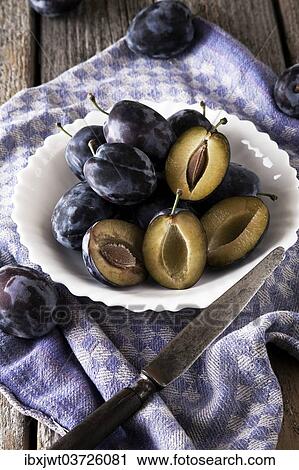 "Fresh plums (Prunus domestica) on plate, with a knife and a kitchen towel" View Large Photo Image Stock Image - "Fresh plums (Prunus domestica) on plate, with a knife and a kitchen towel". Fotosearch