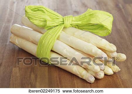 "Fresh unpeeled white asparagus, wrapped with a green ribbon" View Large Photo Image Stock Photography - "Fresh unpeeled white asparagus, wrapped with a green ribbon". Fotosearch