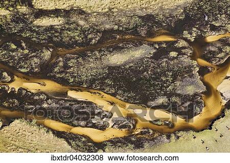 Stock Photo - "Freshwater marshes with sandy streams, channels and islands, aerial view, Okavango Delta, Botswana, Africa". Fotosearch