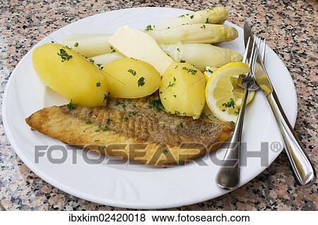 "Fried salmon with asparagus, butter and boiled potatoes" View Large Photo Image Stock Photo - "Fried salmon with asparagus, butter and boiled potatoes". Fotosearch
