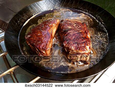 "Fried steaks in a pan, Germany, Europe" View Large Photo Image Stock Image - "Fried steaks in a pan, Germany, Europe". Fotosearch