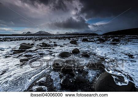 "Frozen Seljalandsa river with dramatic cloudy sky, Vik, Iceland, Europe" View Large Photo Image Stock Image - "Frozen Seljalandsa river with dramatic cloudy sky, Vik, Iceland, Europe". Fotosearch