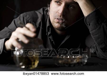 Frustrated man with alcohol and cigarette View Large Photo Image Stock Image - Frustrated man with alcohol and cigarette. Fotosearch