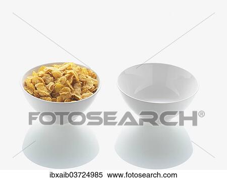 Full bowl of cornflakes and empty bowl View Large Photo Image Stock Photography - Full bowl of cornflakes and empty bowl. Fotosearch
