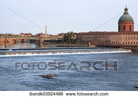 Stock Photograph - "Garonne river, in back Hopital de La Grave in the evening light, Toulouse, Midi-Pyrenees France". Fotosearch