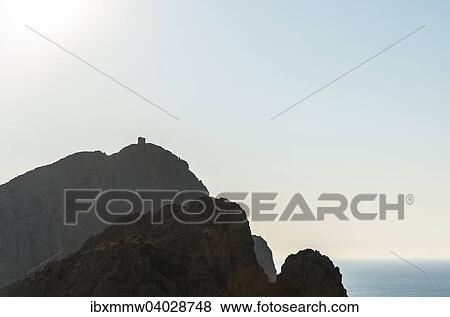 Stock Photo - "Genoese tower on a mountain on the coast, silhouette, Gulf of Porto, Corsica, France, Europe". Fotosearch