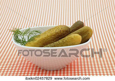 Gherkins in a white porcelain bowl View Large Photo Image Stock Photo - Gherkins in a white porcelain bowl. Fotosearch