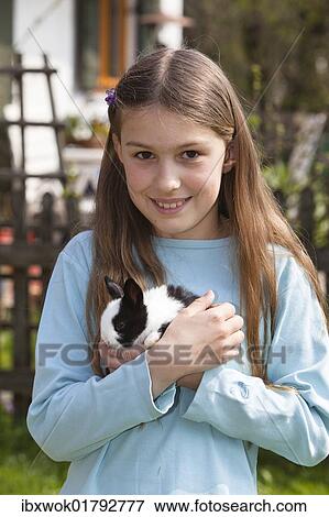 "Girl, 10 years old, with pet rabbit" View Large Photo Image Stock Photo - "Girl, 10 years old, with pet rabbit". Fotosearch