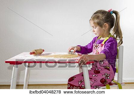Stock Photo - "Girl, 3 years, baking Christmas cookies". Fotosearch
