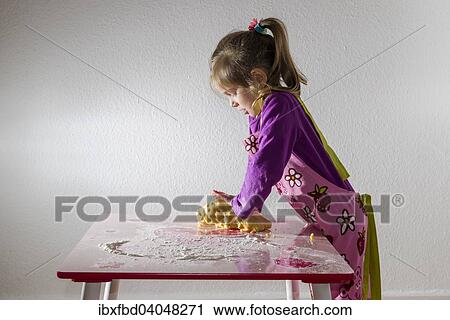 "Girl, 3 years, baking, kneading a lump of dough on a table" View Large Photo Image Stock Image - "Girl, 3 years, baking, kneading a lump of dough on a table". Fotosearch