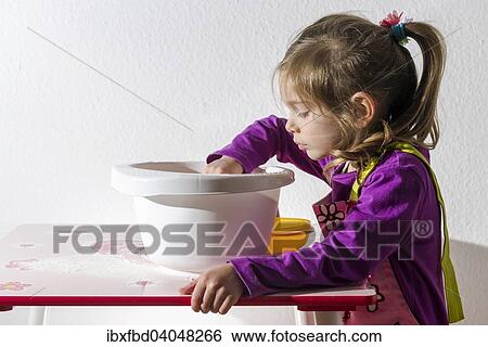 "Girl, 3 years, baking, stirring ingredients in a white bowl" View Large Photo Image Stock Photograph - "Girl, 3 years, baking, stirring ingredients in a white bowl". Fotosearch