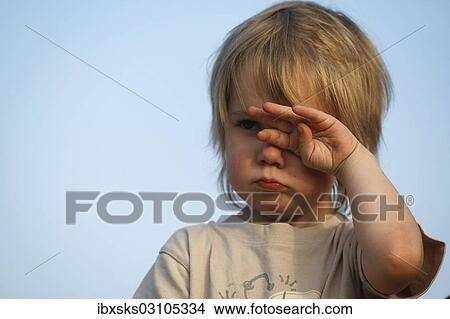 Picture - "Girl, 4, tiredly rubbing her eyes". Fotosearch
