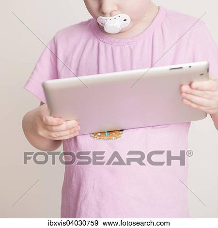 "Girl, 4 years, using a tablet computer" View Large Photo Image Stock Photo - "Girl, 4 years, using a tablet computer". Fotosearch