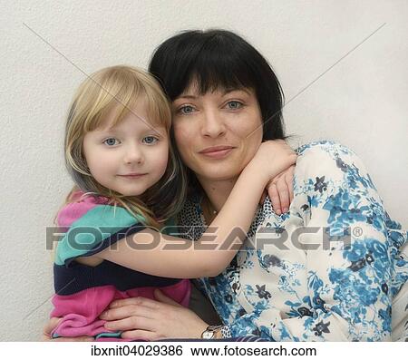 "Girl, 5 years, hugging her mother, 35 years" View Large Photo Image Stock Photograph - "Girl, 5 years, hugging her mother, 35 years". Fotosearch