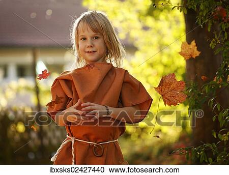"Girl, 7 years, on a playground with autumn foliage" View Large Photo Image Stock Image - "Girl, 7 years, on a playground with autumn foliage". Fotosearch