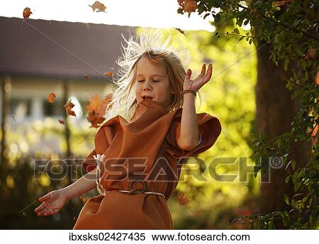 "Girl, 7 years, on a playground with autumn foliage" View Large Photo Image Stock Photography - "Girl, 7 years, on a playground with autumn foliage". Fotosearch