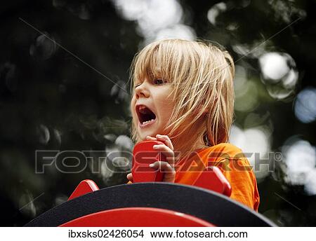 "Girl, 7 years, playground, steering a toy boat" View Large Photo Image Picture - "Girl, 7 years, playground, steering a toy boat". Fotosearch
