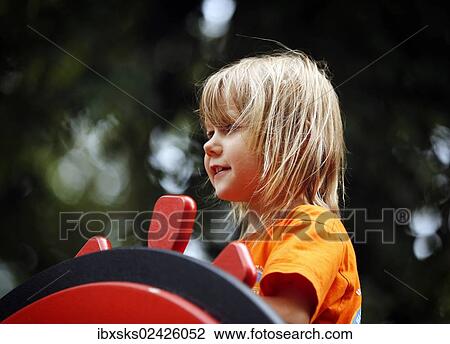 "Girl, 7 years, playground, steering a toy boat" View Large Photo Image Stock Image - "Girl, 7 years, playground, steering a toy boat". Fotosearch