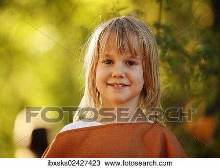 "Girl, 7 years, portrait, outdoors, autumn light" View Large Photo Image Stock Image - "Girl, 7 years, portrait, outdoors, autumn light". Fotosearch