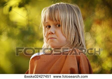 "Girl, 7 years, portrait, outdoors, autumn light, making faces" View Large Photo Image Stock Image - "Girl, 7 years, portrait, outdoors, autumn light, making faces". Fotosearch