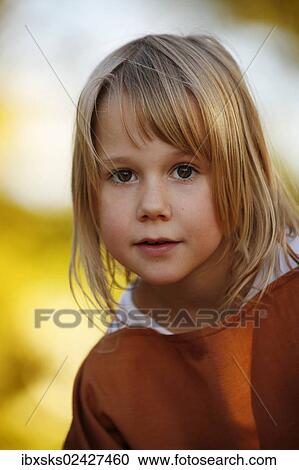 "Girl, 7 years, portrait, outdoors, autumn light" View Large Photo Image Stock Image - "Girl, 7 years, portrait, outdoors, autumn light". Fotosearch