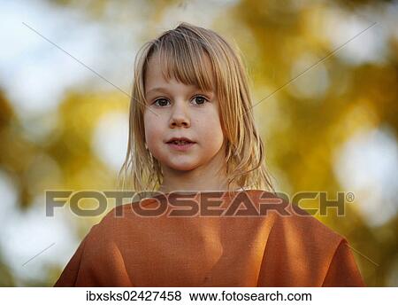 "Girl, 7 years, portrait, outdoors, autumn light" View Large Photo Image Stock Photo - "Girl, 7 years, portrait, outdoors, autumn light". Fotosearch