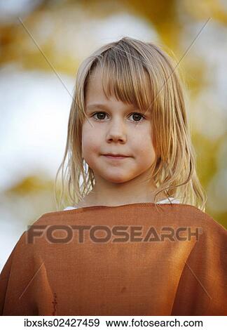 "Girl, 7 years, portrait, outdoors, autumn light" View Large Photo Image Stock Photo - "Girl, 7 years, portrait, outdoors, autumn light". Fotosearch
