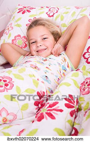 "Girl, 8, lying in bed" View Large Photo Image Picture - "Girl, 8, lying in bed". Fotosearch