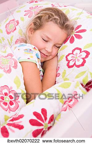 "Girl, 8, lying in bed" View Large Photo Image Stock Image - "Girl, 8, lying in bed". Fotosearch