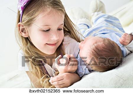 "Girl and a baby, 1 month" View Large Photo Image Stock Photography - "Girl and a baby, 1 month". Fotosearch