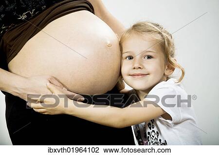 Girl and belly of pregnant mother View Large Photo Image Stock Image - Girl and belly of pregnant mother. Fotosearch