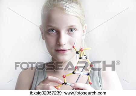 Stock Photo - Girl constructing a molecular model. Fotosearch