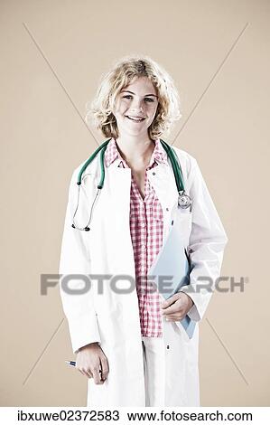 Girl dressed as a carer with a stethoscope View Large Photo Image Stock Image - Girl dressed as a carer with a stethoscope. Fotosearch