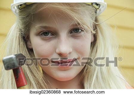 Girl dressed as a construction worker with a hard hat and a hammer View Large Photo Image Stock Photo - Girl dressed as a construction worker with a hard hat and a hammer. Fotosearch