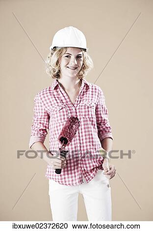 Girl dressed like a painter wearing a hard hat View Large Photo Image Stock Image - Girl dressed like a painter wearing a hard hat. Fotosearch