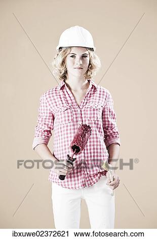 Girl dressed like a painter wearing a hard hat View Large Photo Image Stock Image - Girl dressed like a painter wearing a hard hat. Fotosearch