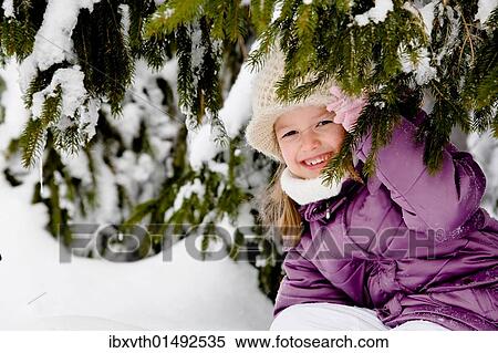 Girl in snow-covered forest View Large Photo Image Stock Photography - Girl in snow-covered forest. Fotosearch
