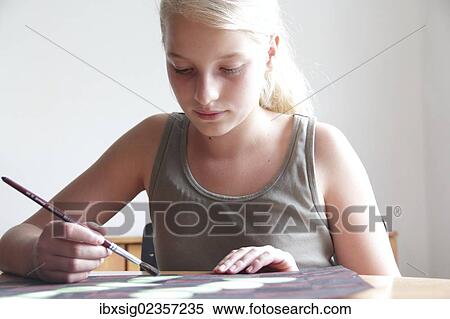 Stock Photography - Girl painting a picture. Fotosearch