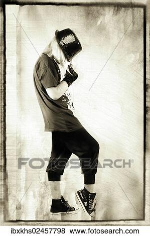 Stock Photo - "Girl posing with a hat, image processing". Fotosearch