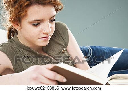 Stock Photograph - Girl reading a book. Fotosearch