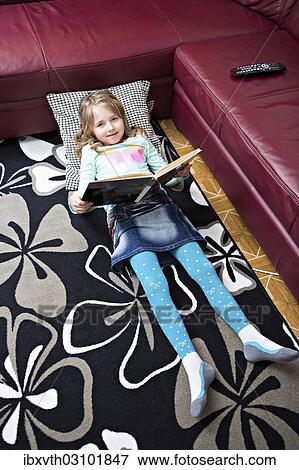 Stock Photo - "Girl reading at home, Germany, Europe". Fotosearch